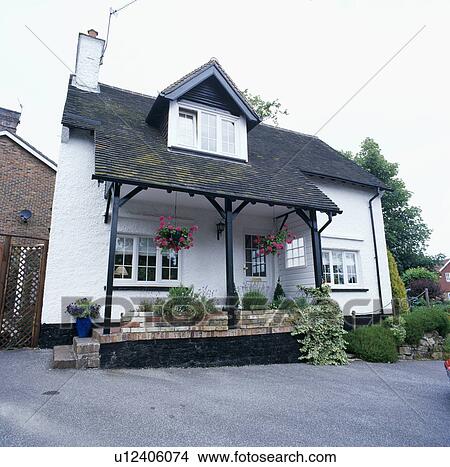 Dormer window above porch on white country cottage View Large Photo Image Picture - Dormer window above porch on white country cottage. Fotosearch
