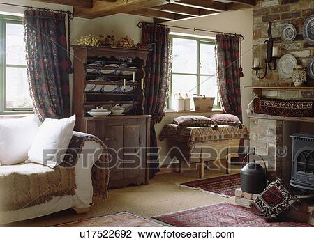Dresser and white sofa in cottage living room View Large Photo Image Stock Image - Dresser and white sofa in cottage living room. Fotosearch