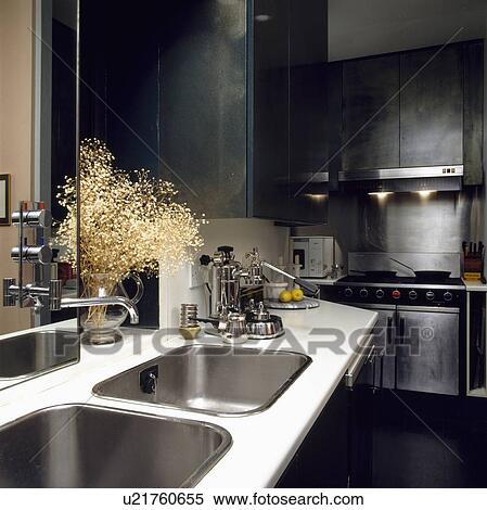 Expresso machine on white worktop with double stainless steel sinks in modern kitchen View Large Photo Image Stock Photography - Expresso machine on white worktop with double stainless steel sinks in modern kitchen. Fotosearch