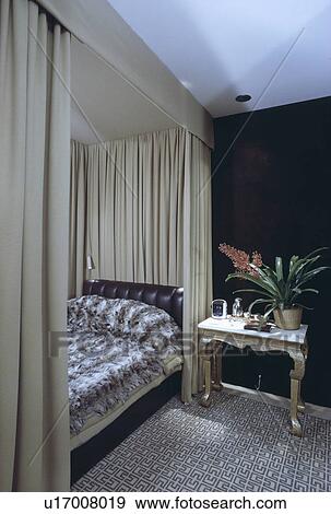 Faux Fur Cover On Bed With Beige Drapes In Bedroom With Patterned