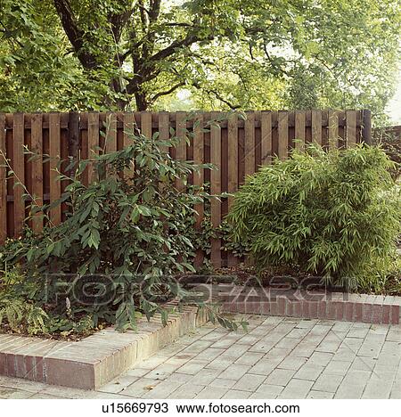 Fence in green country garden in summer View Large Photo Image Stock Image - Fence in green country garden in summer. Fotosearch