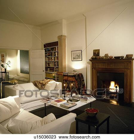 Fireplace and white sofas in modern living room View Large Photo Image Stock Image - Fireplace and white sofas in modern living room. Fotosearch