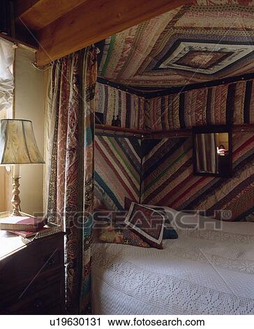 Fitted bed with patchwork quilting on walls and ceiling View Large Photo Image Stock Image - Fitted bed with patchwork quilting on walls and ceiling. Fotosearch