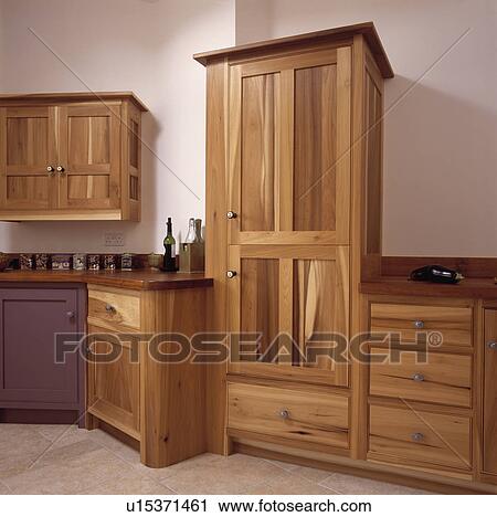 Fitted Shaker-style wooden kitchen View Large Photo Image Stock Image - Fitted Shaker-style wooden kitchen. Fotosearch