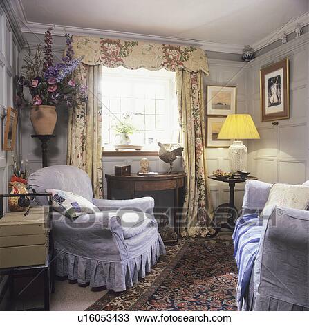 Floral curtains and blue armchairs in country living room View Large Photo Image Stock Image - Floral curtains and blue armchairs in country living room. Fotosearch