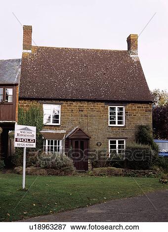 For Sale sign in front of country cottage View Large Photo Image Stock Photo - For Sale sign in front of country cottage. Fotosearch