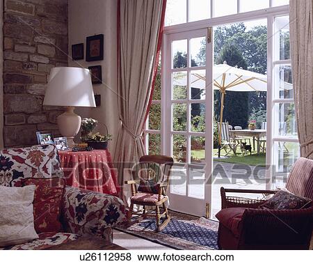 French windows in traditional country living room View Large Photo Image Stock Photo - French windows in traditional country living room. Fotosearch