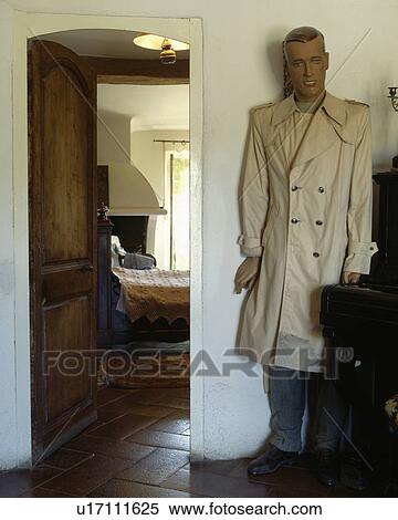 Fullsize mannequin beside open door to cottage bedroom View Large Photo Image Stock Photography - Fullsize mannequin beside open door to cottage bedroom. Fotosearch
