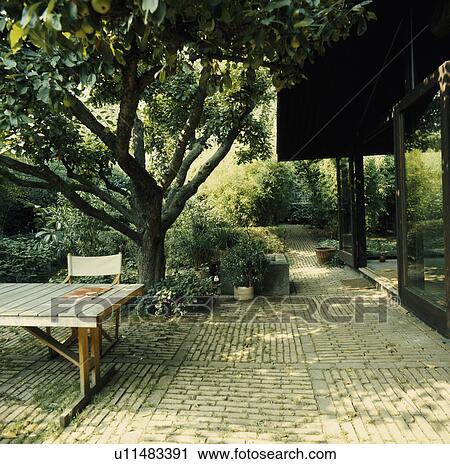 Furniture on patio in country garden in summer View Large Photo Image Stock Image - Furniture on patio in country garden in summer. Fotosearch
