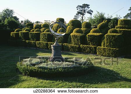 Gimbal and topiary in large country garden View Large Photo Image Picture - Gimbal and topiary in large country garden. Fotosearch