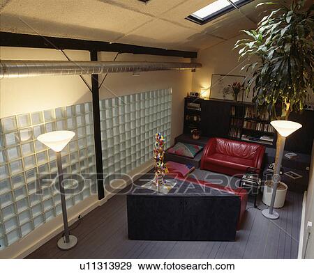 Glass brick wall in modern living room with red leather sofas View Large Photo Image Stock Photo - Glass brick wall in modern living room with red leather sofas. Fotosearch