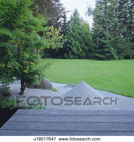 Gravel pyramid in raked gravel Zen garden in large country garden with mown lawn View Large Photo Image Stock Photo - Gravel pyramid in raked gravel Zen garden in large country garden with mown lawn. Fotosearch