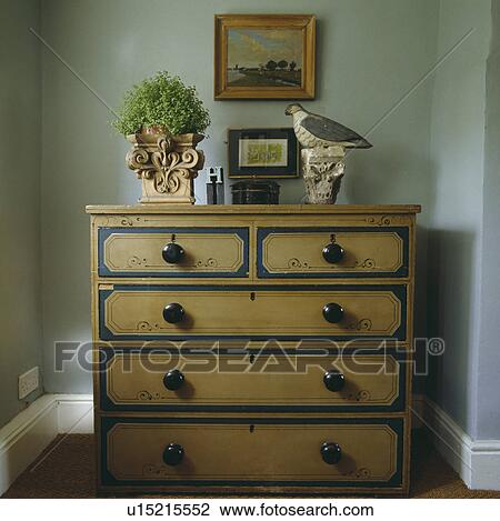 Helxine in pot and carved bird ornament on antique pine chest-of-drawers View Large Photo Image Stock Image - Helxine in pot and carved bird ornament on antique pine chest-of-drawers. Fotosearch
