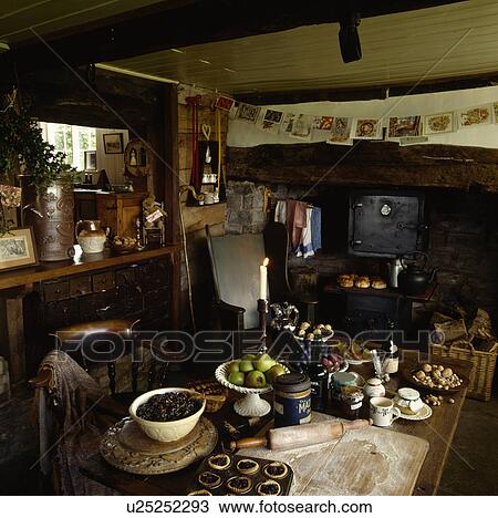 Ingredients and equipment for making mincepies on table in cottage kitchen with black stove View Large Photo Image Stock Image - Ingredients and equipment for making mincepies on table in cottage kitchen with black stove. Fotosearch