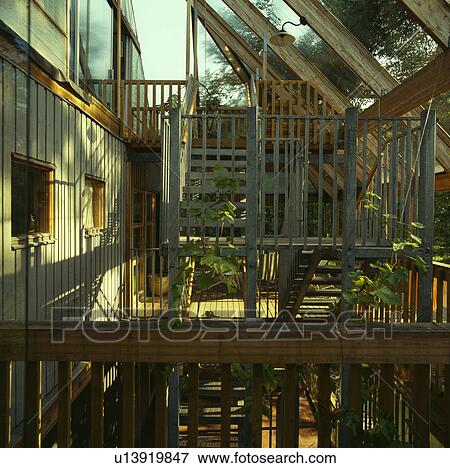 Inside large ecological designed glass and wood conservatory View Large Photo Image Stock Photo - Inside large ecological designed glass and wood conservatory. Fotosearch