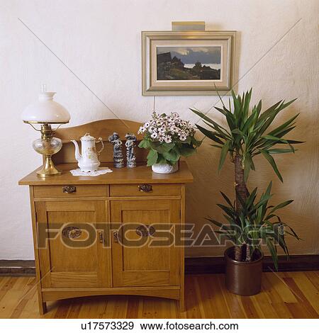 interior, houseplants, wood cabinet View Large Photo Image Stock Photo - interior, houseplants, wood cabinet. Fotosearch