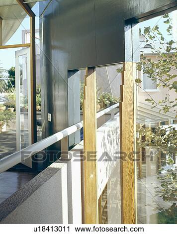 Stock Image - Internal balcony linking the interior to the exterior of modern architectural house in California. Fotosearch