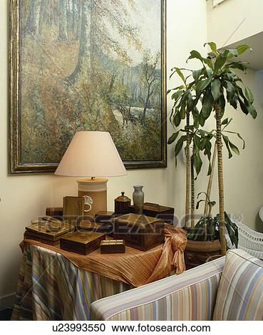 Stock Image - Lamp on small table. Fotosearch