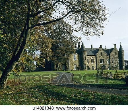 Stock Photo - Large country house with towers and turrets . Fotosearch