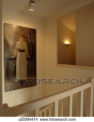 Large Edwardian picture on wall above stairs in modern landing View Large Photo Image Picture - Large Edwardian picture on wall above stairs in modern landing. Fotosearch