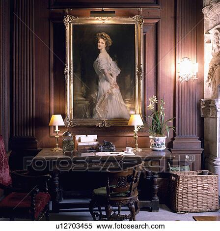 Large Edwardian portrait above table with lighted lamps in panelled study View Large Photo Image Stock Photography - Large Edwardian portrait above table with lighted lamps in panelled study. Fotosearch