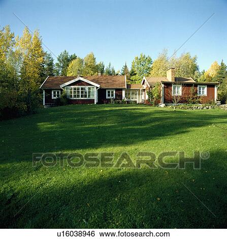Large lawn in front of small single-storey German cottages View Large Photo Image Stock Photograph - Large lawn in front of small single-storey German cottages. Fotosearch