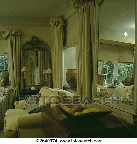 Large mirror in traditional country living room View Large Photo Image Picture - Large mirror in traditional country living room . Fotosearch
