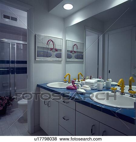 Large modern bathroom with yellow mixer taps View Large Photo Image Stock Photo - Large modern bathroom with yellow mixer taps. Fotosearch