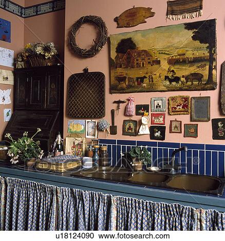 Large painting and collection of small pictures on pink wall in cottage kitchen View Large Photo Image Stock Image - Large painting and collection of small pictures on pink wall in cottage kitchen. Fotosearch