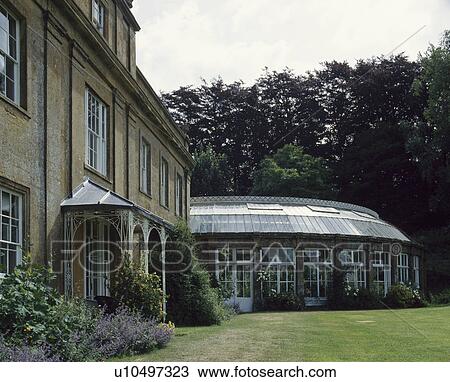 Large Victorian country house with traditional curved conservatory extension View Large Photo Image Stock Image - Large Victorian country house with traditional curved conservatory extension. Fotosearch