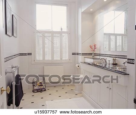 Large white traditional bathroom with shutters. View Large Photo Image Stock Photo - Large white traditional bathroom with shutters.. Fotosearch