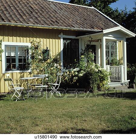 Lawn in front of cottage in summer country garden View Large Photo Image Stock Image - Lawn in front of cottage in summer country garden. Fotosearch
