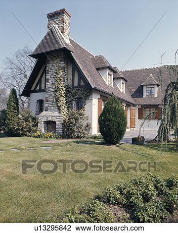 Lawn In Front Of Traditional Country House In France With Dormer