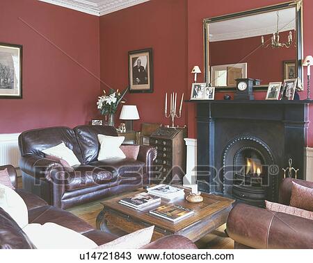 Leather sofa in red living room View Large Photo Image Stock Image - Leather sofa in red living room. Fotosearch