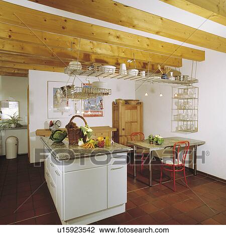 Metal storage rack on beamed ceiling in kitchen dining room View Large Photo Image Stock Image - Metal storage rack on beamed ceiling in kitchen dining room. Fotosearch