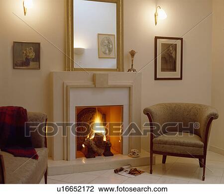 Stock Image - Mirror above fireplace in modern living room. Fotosearch