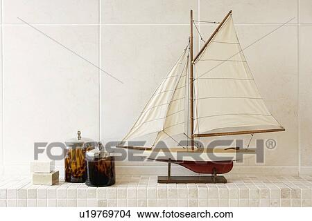 Model sailing boat on shelf in the bathroom as decoration View Large Photo Image Picture - Model sailing boat on shelf in the bathroom as decoration. Fotosearch