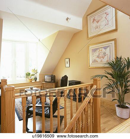 Modern attic converssion living room with portable television View Large Photo Image Stock Photo - Modern attic converssion living room with portable television. Fotosearch