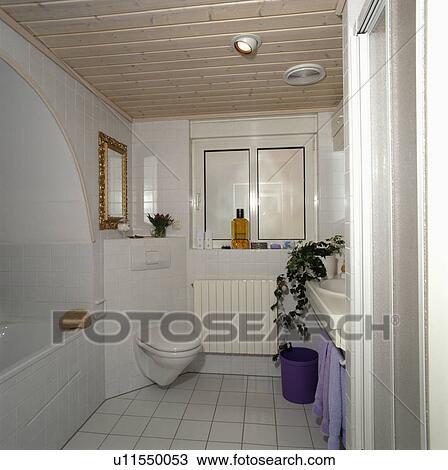 Modern Bathroom With Wooden Plank Ceiling And Corner Fitted