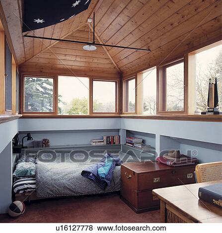 Stock Photo - Modern child's room with built in shelving and bed.. Fotosearch