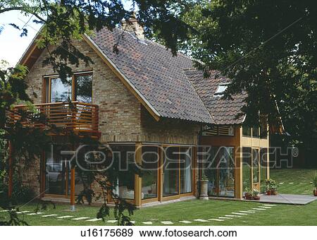 Modern country house with reclaimed roof pantiles and wooden balcony View Large Photo Image Stock Photo - Modern country house with reclaimed roof pantiles and wooden balcony. Fotosearch