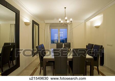 Modern diningroom with wall lights and black furniture and black-framed mirrors View Large Photo Image Stock Image - Modern diningroom with wall lights and black furniture and black-framed mirrors. Fotosearch