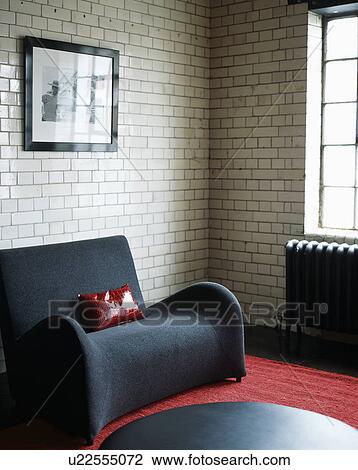 Modern grey armchair in modern living room with white tiled wall View Large Photo Image Stock Image - Modern grey armchair in modern living room with white tiled wall. Fotosearch