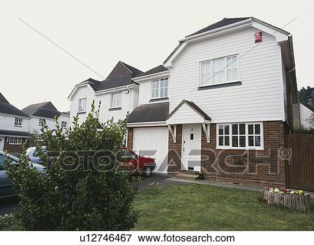 New-build house with white wood cladding View Large Photo Image Stock Photo - New-build house with white wood cladding. Fotosearch