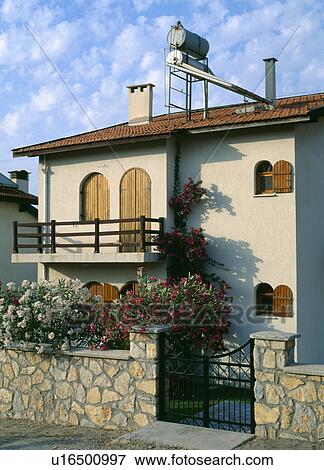 Newly built Turkish house with tanks on roof for solar powered water system View Large Photo Image Stock Photo - Newly built Turkish house with tanks on roof for solar powered water system . Fotosearch