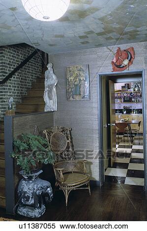 Old cane chair in small hall with textured ceiling and view of kitchen through open door View Large Photo Image Stock Photography - Old cane chair in small hall with textured ceiling and view of kitchen through open door. Fotosearch