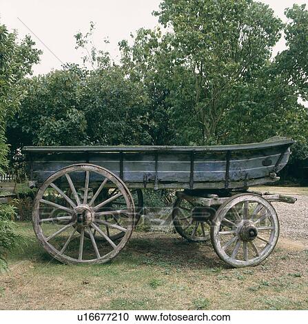 Old wooden farm cart in country garden View Large Photo Image Stock Image - Old wooden farm cart in country garden. Fotosearch