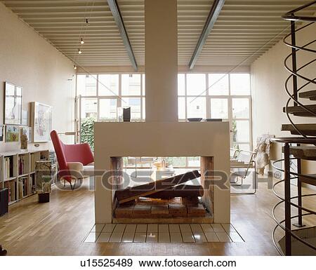 Open Central Fireplace In Modern Living Room Stock Photo