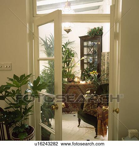 Stock Image - Open door to living room. Fotosearch
