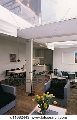 Openplan architectural living and dining room with corner kitchen with wooden flooring View Large Photo Image Stock Image - Openplan architectural living and dining room with corner kitchen with wooden flooring . Fotosearch
